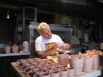 Joe Pinder glazing pottery